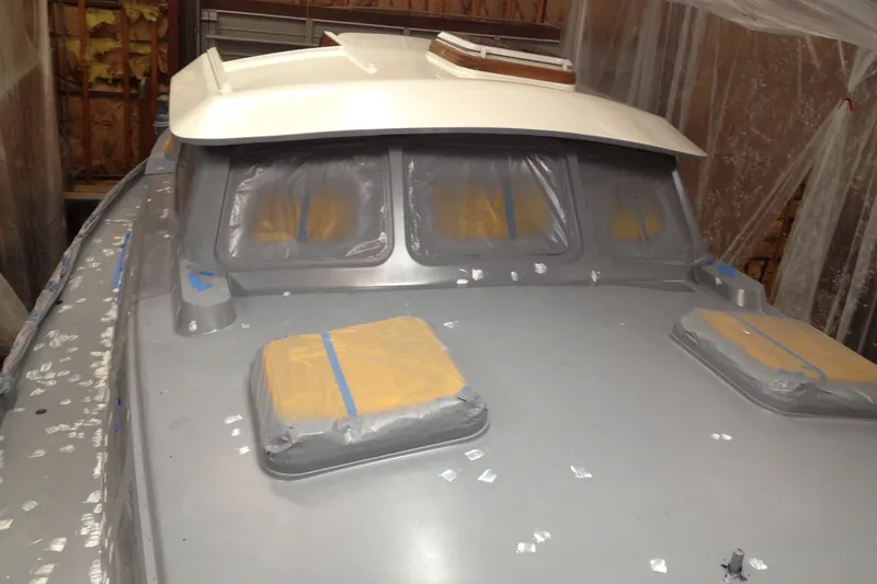 Slide: The Image of 1980 Cheoy Lee 43 Pilot House undergoing restoration in a workshop. - 95