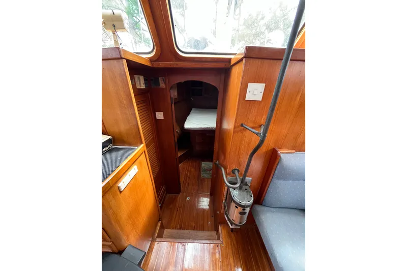 Slide: The Image of Interior of 1980 Cheoy Lee 43 Pilot House with wooden finish and cozy cabin. - 55