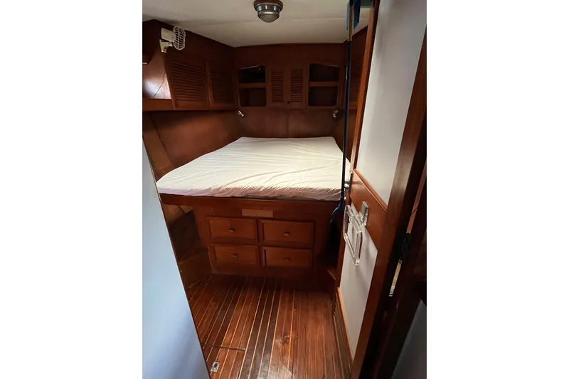 Slide: The Image of Cozy cabin interior of 1980 Cheoy Lee 43 Pilot House with wooden furnishings. - 59