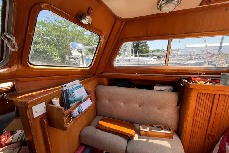 Slide: The Image of Interior of 1980 Cheoy Lee 43 Pilot House with wooden furnishings and large windows. - 36