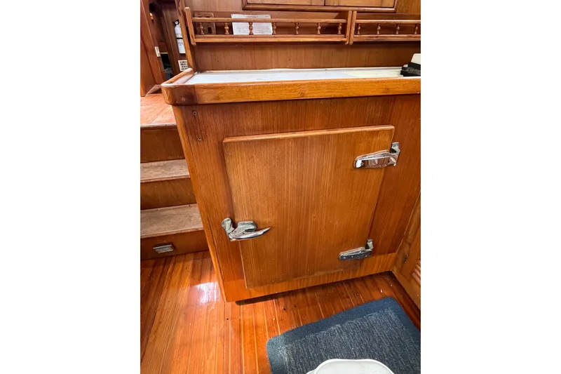 Slide: The Image of Wooden interior of 1980 Cheoy Lee 43 Pilot House with cabinet and steps. - 50