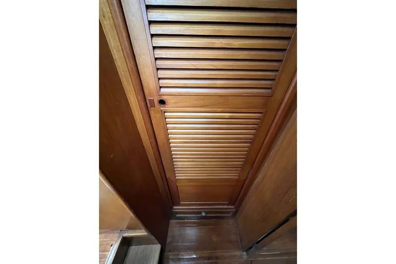 Slide: The Image of Wooden louvered door inside 1980 Cheoy Lee 43 Pilot House yacht interior. - 56