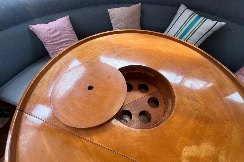 Slide: The Image of Wooden table with circular cutout on a 1980 Cheoy Lee 43 Pilot House yacht. - 75