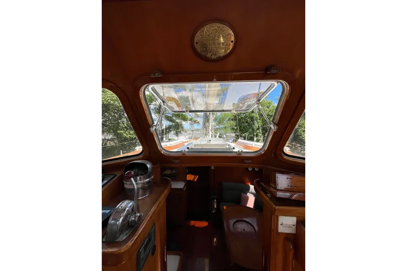 Slide: The Image of Interior view of 1980 Cheoy Lee 43 Pilot House with wooden finish and large windows. - 41