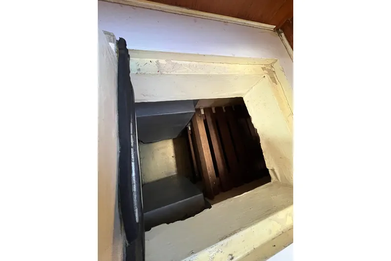 Slide: The Image of Interior view of 1980 Cheoy Lee 43 Pilot House, showcasing a wooden compartment. - 52