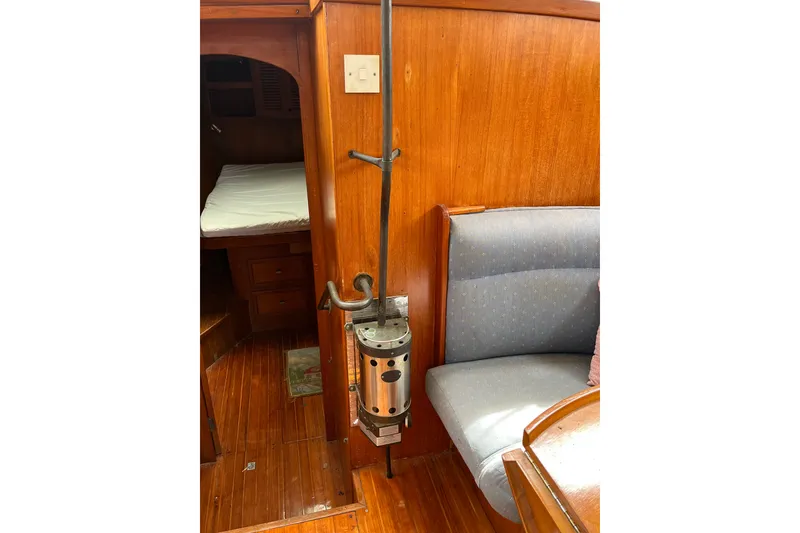 Slide: The Image of Interior of 1980 Cheoy Lee 43 Pilot House with wood paneling and seating area. - 76