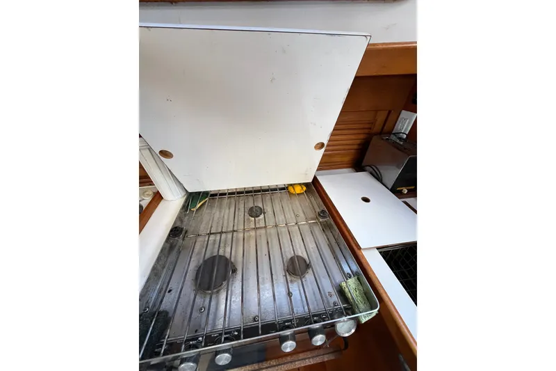 Slide: The Image of 1980 Cheoy Lee 43 Pilot House stove with cover in yacht kitchen. - 49