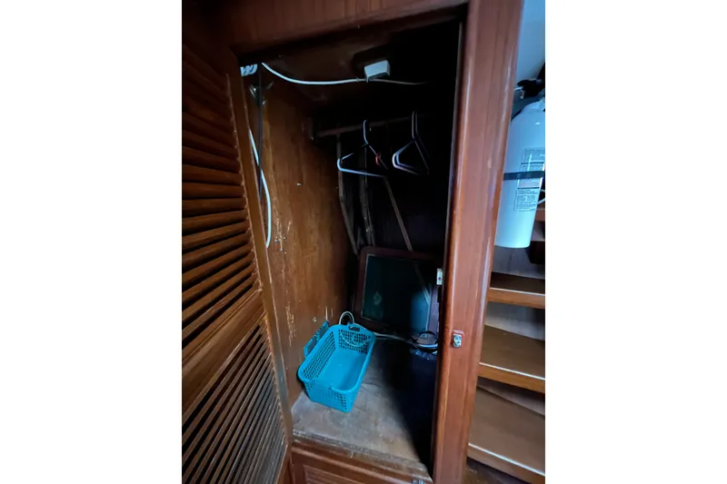 Slide: The Image of Wooden closet interior on 1980 Cheoy Lee 43 Pilot House yacht. - 67