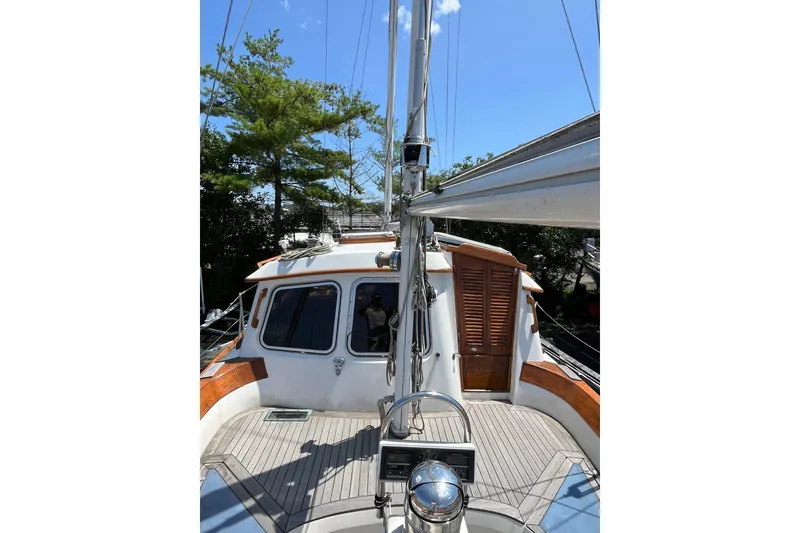 Slide: The Image of 1980 Cheoy Lee 43 Pilot House sailboat deck with mast and cabin view. - 27