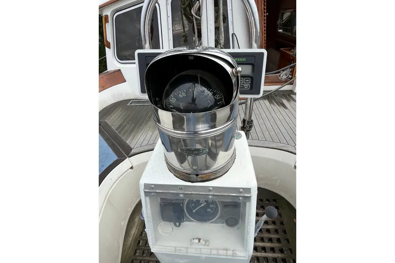 Slide: The Image of Compass and navigation instruments on a 1980 Cheoy Lee 43 Pilot House yacht. - 18