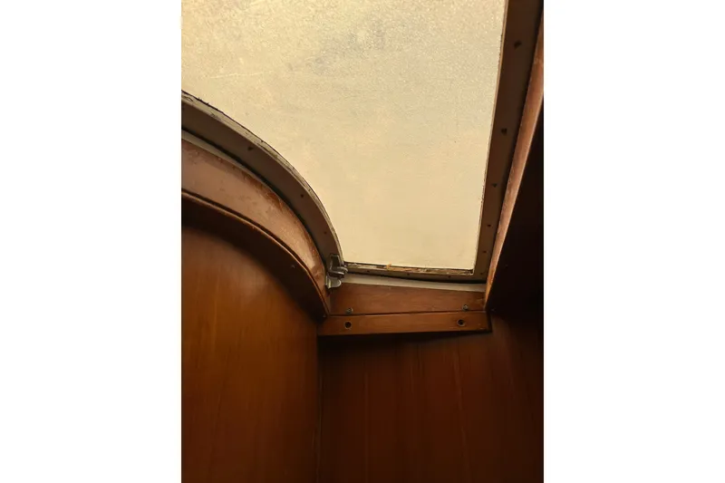 Slide: The Image of Interior view of 1980 Cheoy Lee 43 Pilot House skylight and wooden paneling. - 88