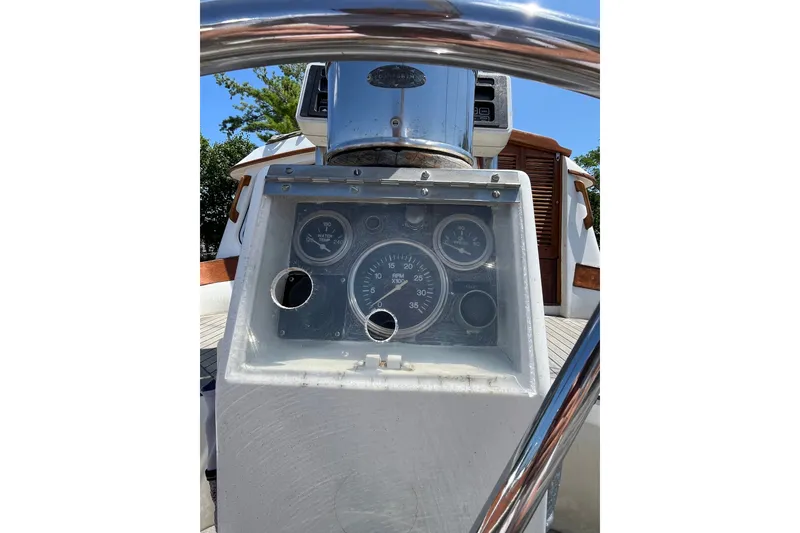 Slide: The Image of 1980 Cheoy Lee 43 Pilot House helm with gauges and steering wheel. - 96