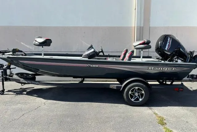 Slide: The Image of 2026 Ranger RT188 fishing boat with trailer, featuring sleek design and Mercury outboard motor. - 1