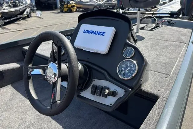 Slide: The Image of 2026 Ranger RT188 boat dashboard with steering wheel and Lowrance display. - 5