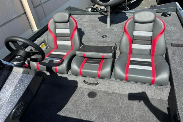 Slide: The Image of 2026 Ranger RT188 boat interior with gray and red seats, steering wheel visible. - 6
