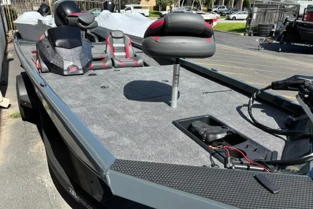 Slide: The Image of 2026 Ranger RT188 fishing boat with gray deck and red-accented seats. - 7