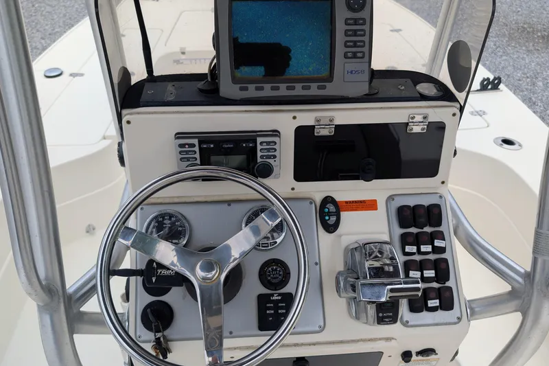 Slide: The Image of Steering console of a 2010 ShearWater 2200X boat with navigation equipment. - 4