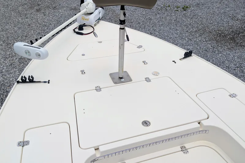Slide: The Image of Bow deck of 2010 ShearWater 2200X boat with trolling motor and storage compartments. - 8