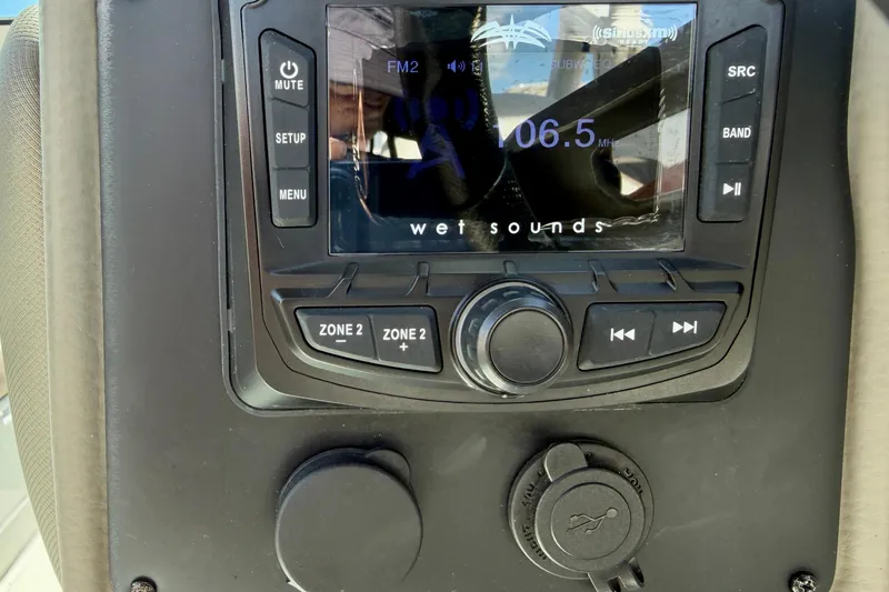 Slide: The Image of 2023 Crownline Eclipse E235 XS audio system with Wet Sounds display and controls. - 18