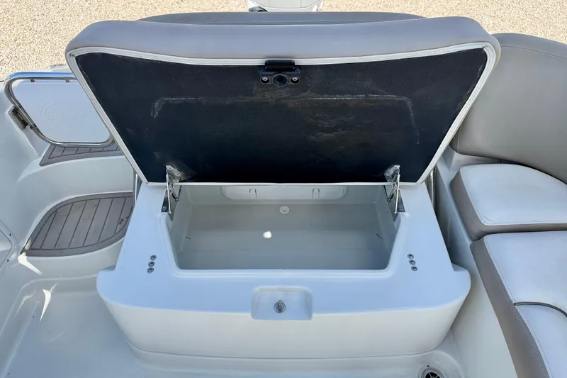 Slide: The Image of Open storage compartment on 2023 Crownline Eclipse E235 XS boat, showcasing interior space. - 29
