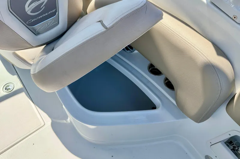 Slide: The Image of 2023 Crownline Eclipse E235 XS boat seat with storage compartment open. - 32
