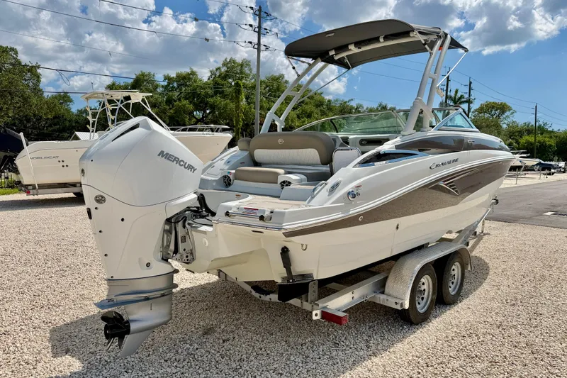 Slide: The Image of 2023 Crownline Eclipse E235 XS boat on trailer with Mercury outboard motor. - 5