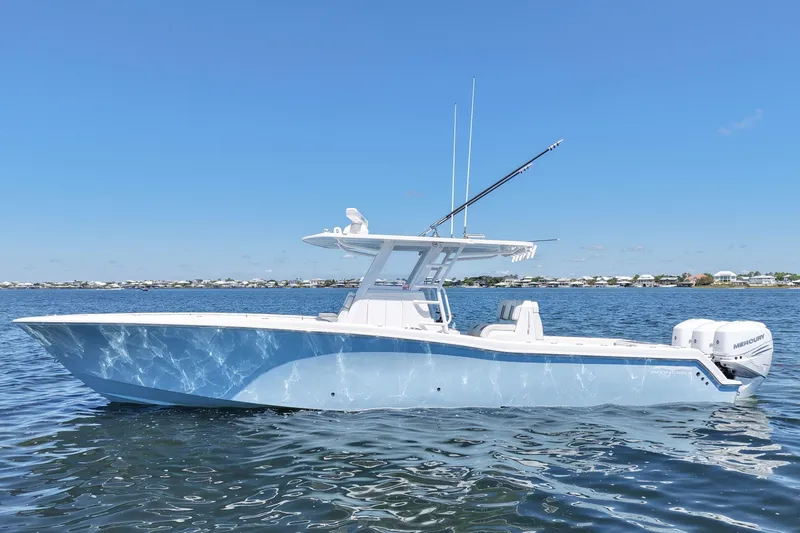 The Image of 2023 Invincible 36 Open Fisherman boat on calm water under clear blue sky. - 0