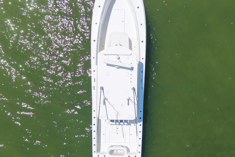 Slide: The Image of Aerial view of 2023 Invincible 36 Open Fisherman boat on green water. - 11