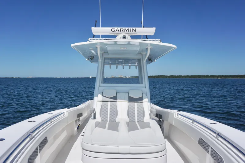 Slide: The Image of 2023 Invincible 36 Open Fisherman boat on calm blue water under clear sky. - 16