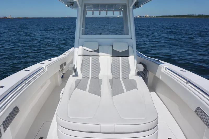Slide: The Image of 2023 Invincible 36 Open Fisherman boat with sleek seating on open water. - 18