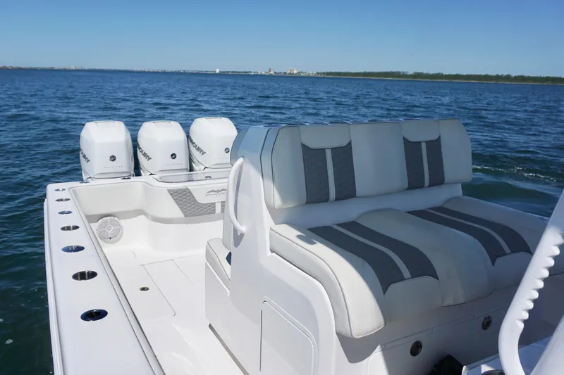 Slide: The Image of 2023 Invincible 36 Open Fisherman boat with triple Mercury engines on open water. - 20