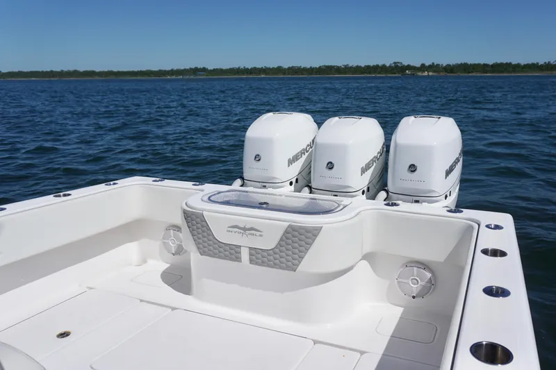Slide: The Image of 2023 Invincible 36 Open Fisherman boat with triple Mercury engines on open water. - 24