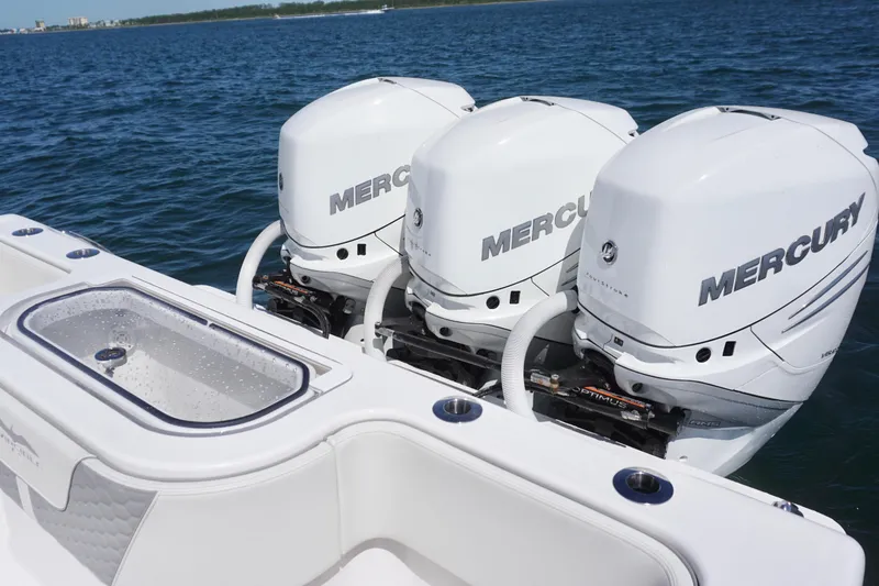 Slide: The Image of Triple Mercury outboard engines on a 2023 Invincible 36 Open Fisherman boat. - 25