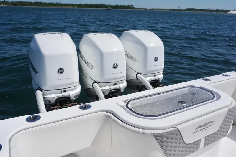 Slide: The Image of 2023 Invincible 36 Open Fisherman with triple Mercury outboard engines on the water. - 26