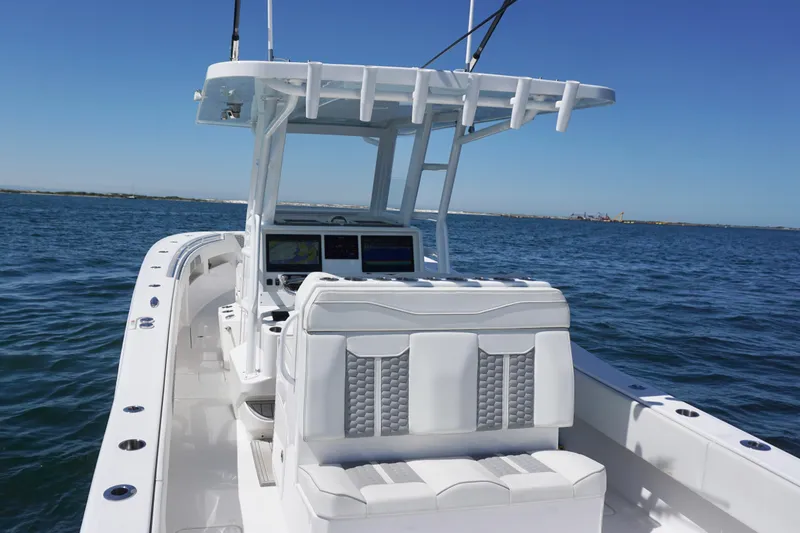 Slide: The Image of 2023 Invincible 36 Open Fisherman boat on open water, featuring modern helm and seating. - 29