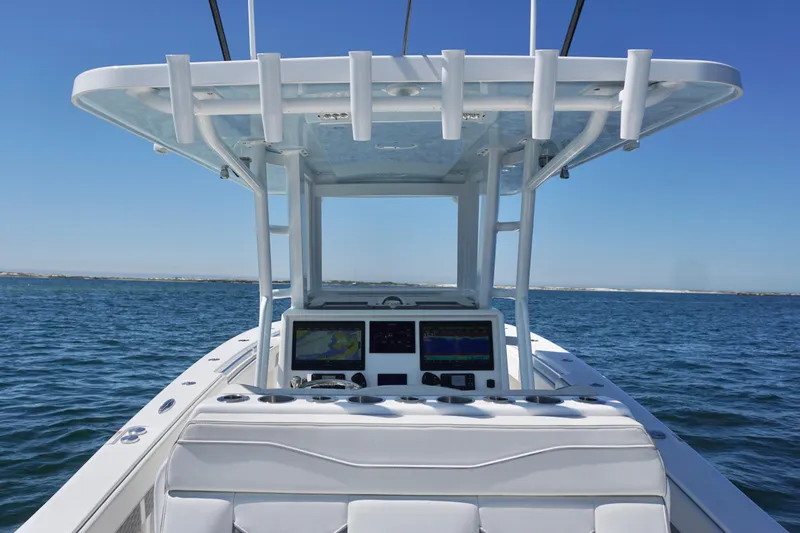 Slide: The Image of 2023 Invincible 36 Open Fisherman boat on open water, featuring advanced navigation systems. - 31