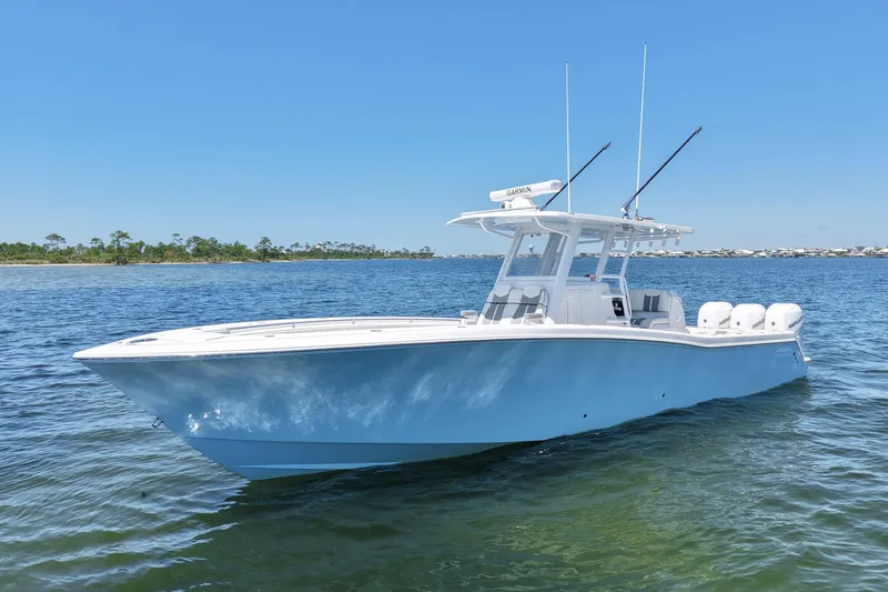 Slide: The Image of 2023 Invincible 36 Open Fisherman boat on calm water under clear blue sky. - 4