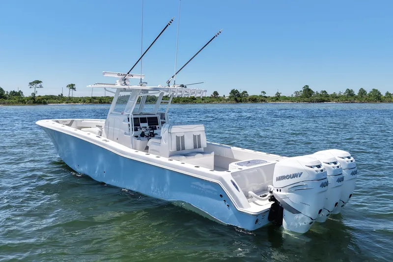 Slide: The Image of 2023 Invincible 36 Open Fisherman boat with triple Mercury 400 engines on water. - 6