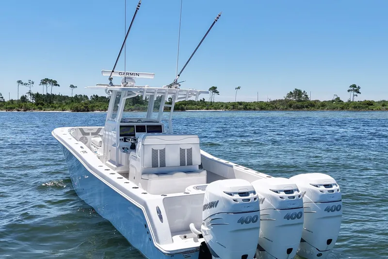 Slide: The Image of 2023 Invincible 36 Open Fisherman boat with triple outboard engines on water. - 7