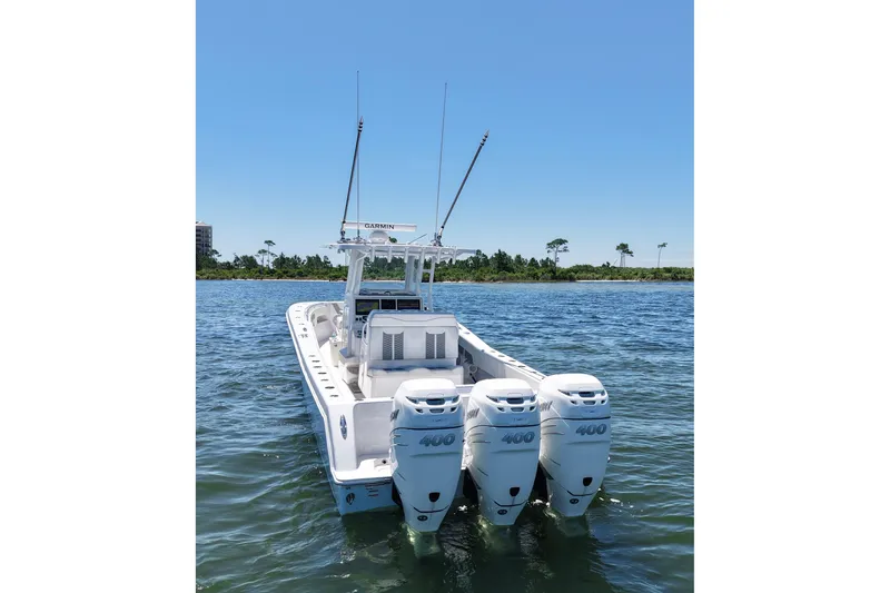 Slide: The Image of 2023 Invincible 36 Open Fisherman boat with triple outboard engines on water. - 8