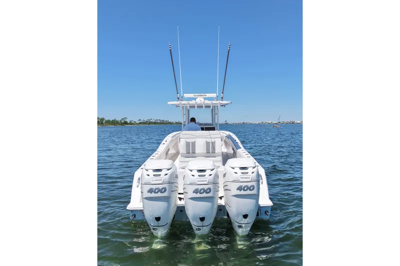 Slide: The Image of 2023 Invincible 36 Open Fisherman boat with triple 400 horsepower engines on the water. - 9