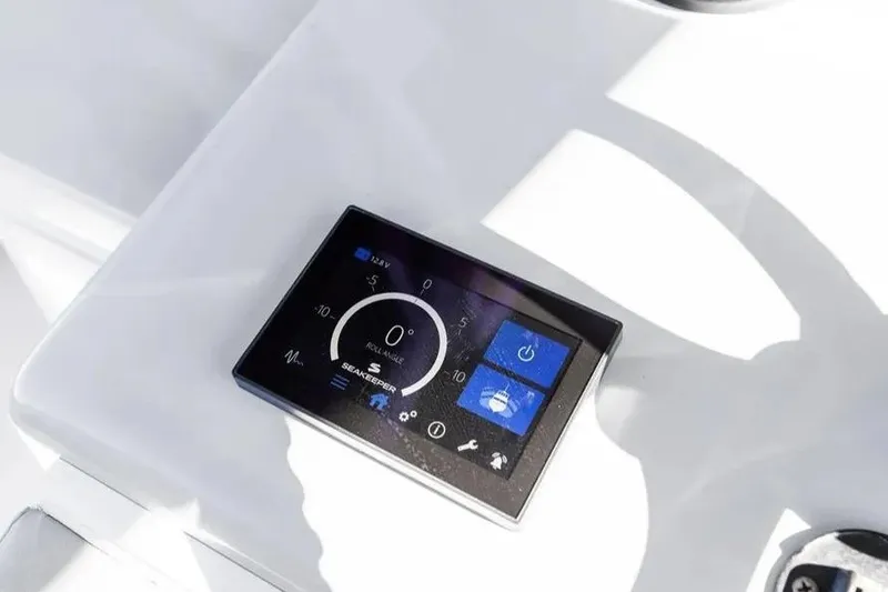 Slide: The Image of Digital control panel on 2022 Contender 44 CB boat dashboard. - 18
