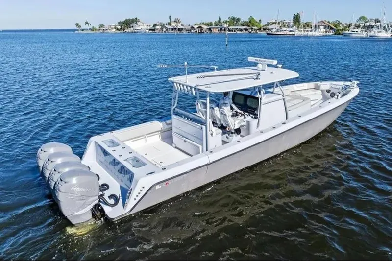 Slide: The Image of 2022 Contender 44 CB boat with triple Mercury engines on open water. - 6