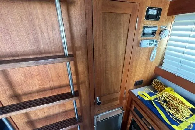 Slide: The Image of Interior of 1989 Carver 3297 Mariner with wooden ladder and control panel. - 14
