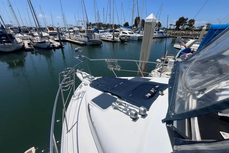 Slide: The Image of 1989 Carver 3297 Mariner yacht docked in a marina with sailboats. - 5