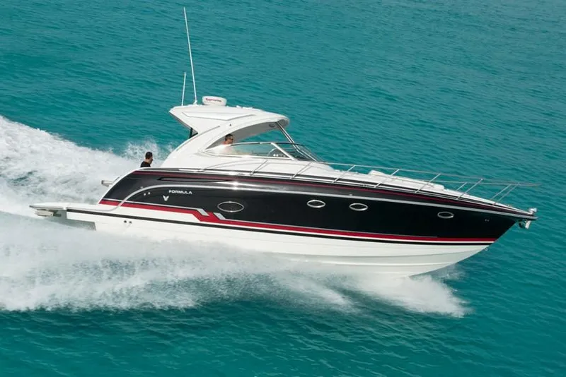 Slide: The Image of Manufacturer Provided Image: 2019 Formula 37 Performance Cruiser speeding on turquoise water. - 1