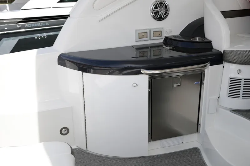 Slide: The Image of Manufacturer Provided Image: 2019 Formula 37 Performance Cruiser interior with mini fridge and counter. - 10