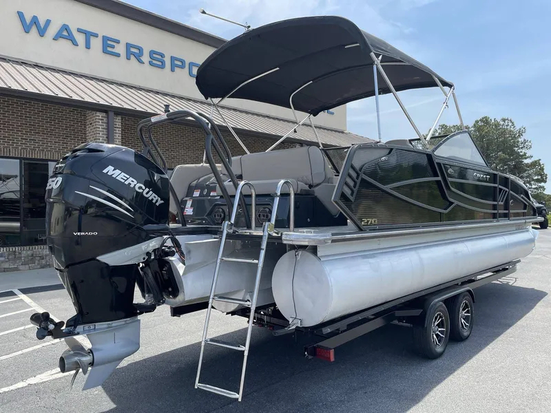 Slide: The Image of 2021 Crest 270 Continental pontoon boat with Mercury Verado engine. - 10
