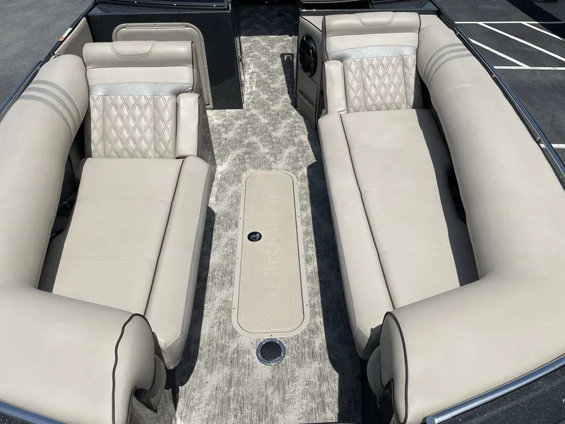 Slide: The Image of Interior of a 2021 Crest 270 Continental boat with beige seating. - 30
