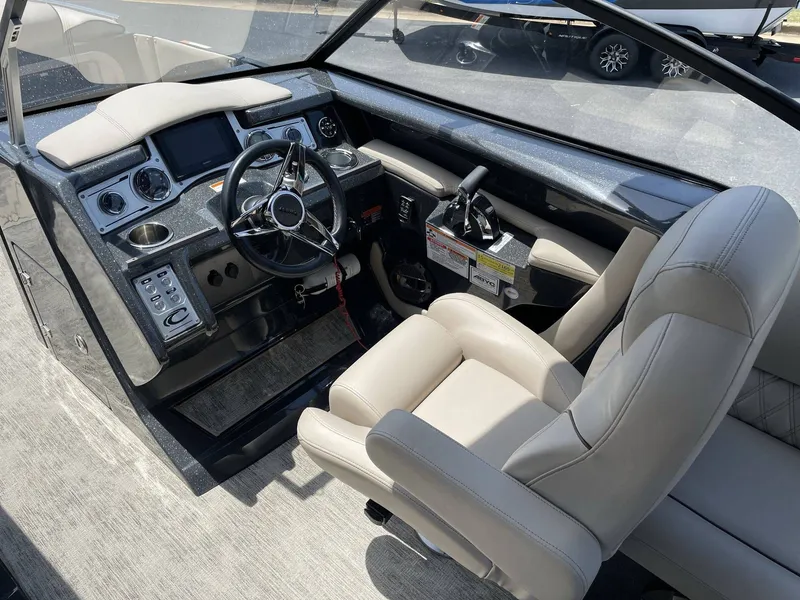 Slide: The Image of Interior of a 2021 Crest 270 Continental boat with steering console. - 33